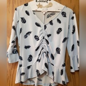 Pretty light blue blouse with navy leaf pattern, 3/4 sleeves with ruffles.